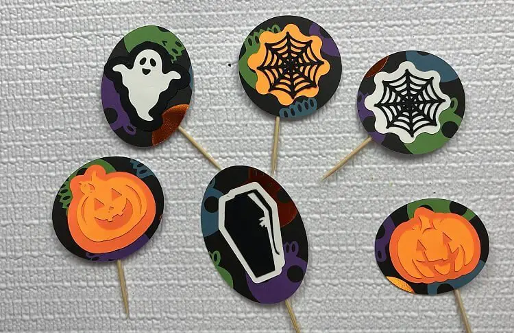 Free Halloween Cupcake Toppers with Cricut gluing toothpicks