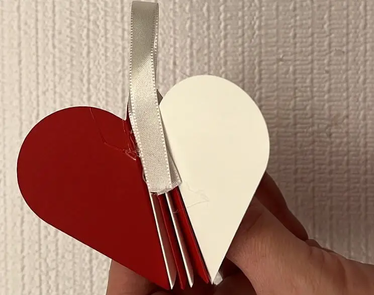 gluing ribbon on paper ornament pieces