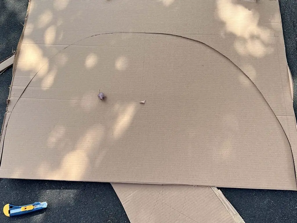 cutting out cardboard skirt for wheelchair