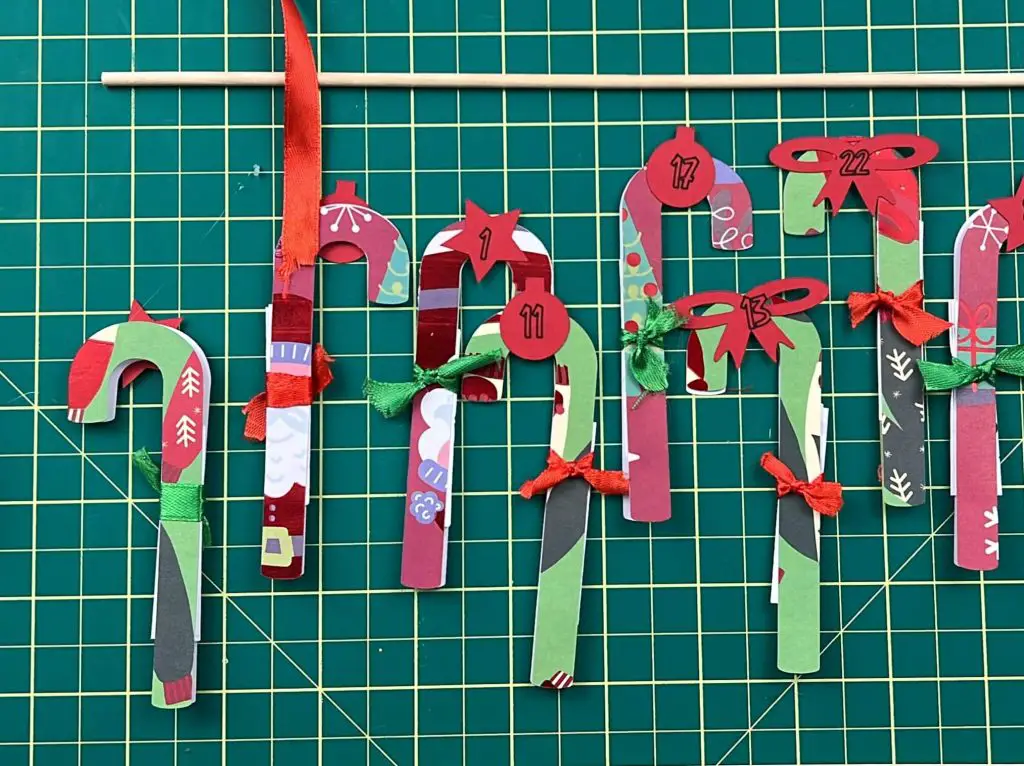 gluing candy canes together family activity holiday countdown calendar