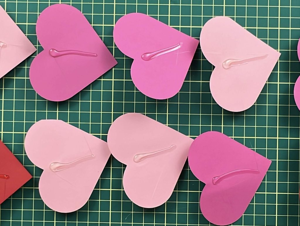 applying glue to hearts