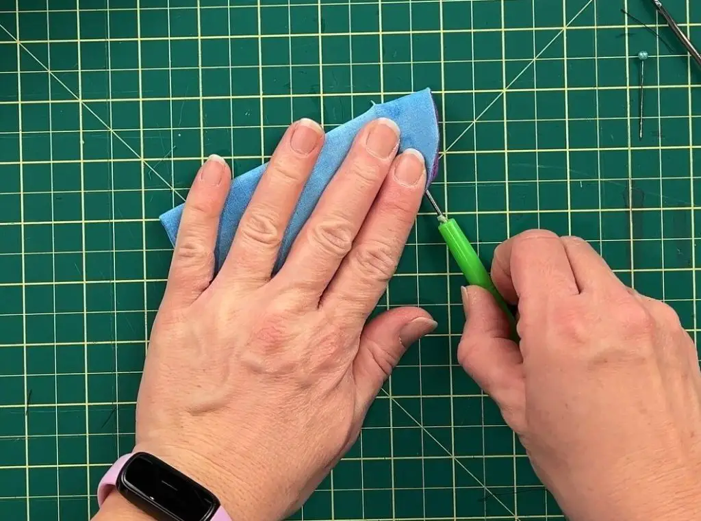 attaching snaps and poking holes in fabric