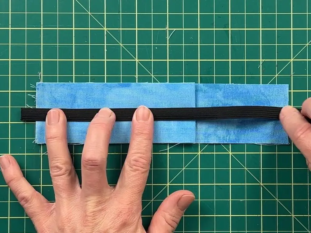 Adding elastic to notebook pen holder